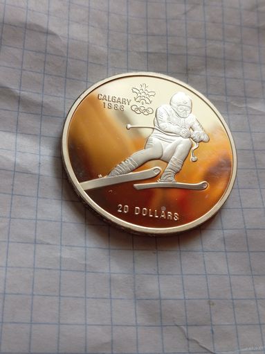 20 долларов 1985 года. Олимпийские игры в Калгари 1988 года. Горные лыжи. Унция серебра в чистоте металла.